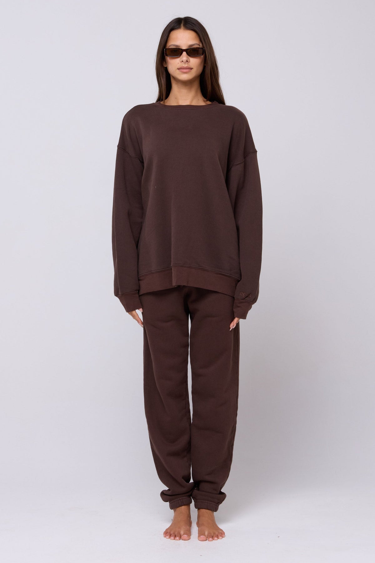 This is an image of Bodhi Sweatpants in Tobacco - RESA featuring a model wearing the dress