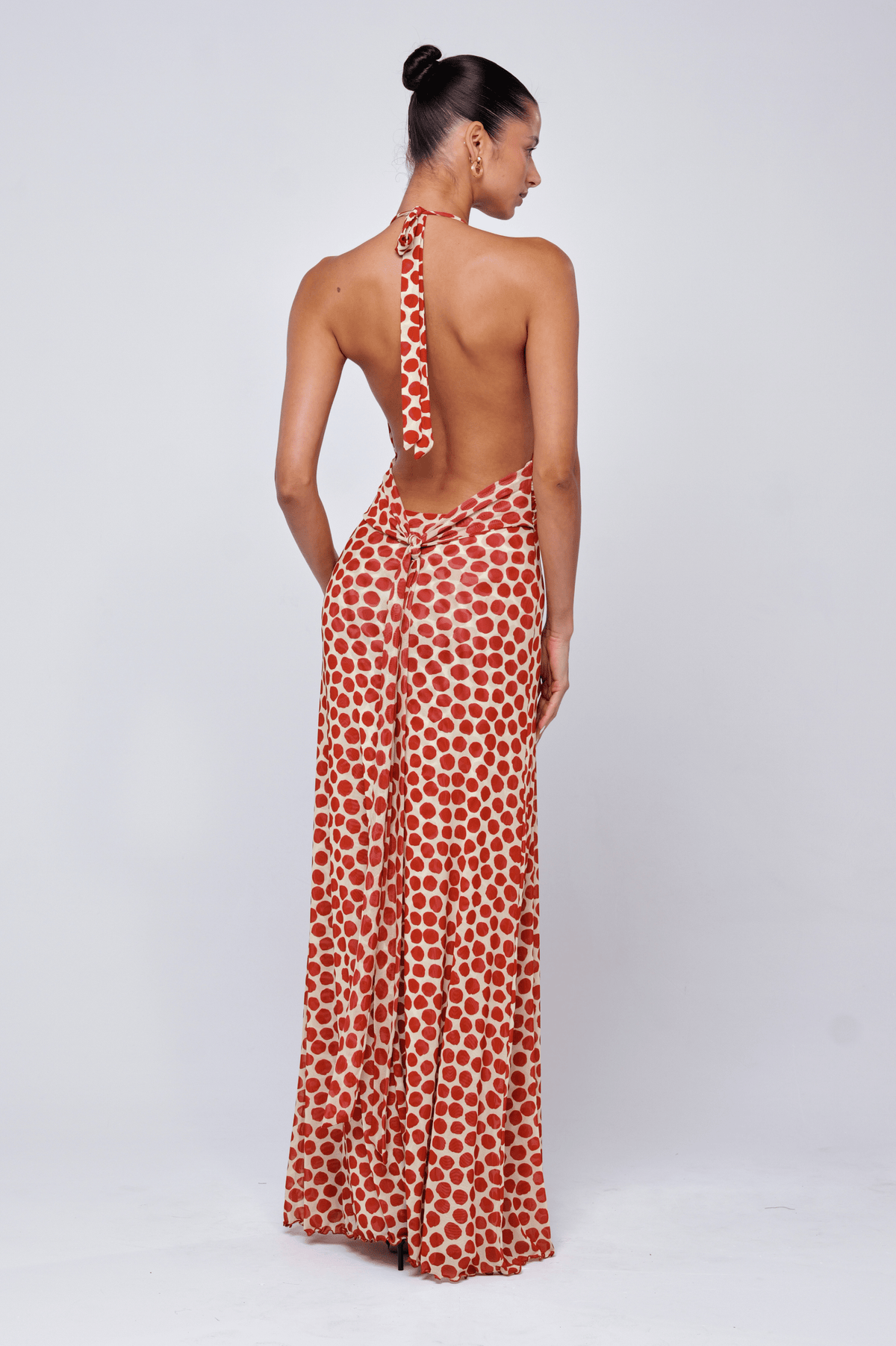 This is an image of Chelsea Dress in Campari - RESA featuring a model wearing the dress