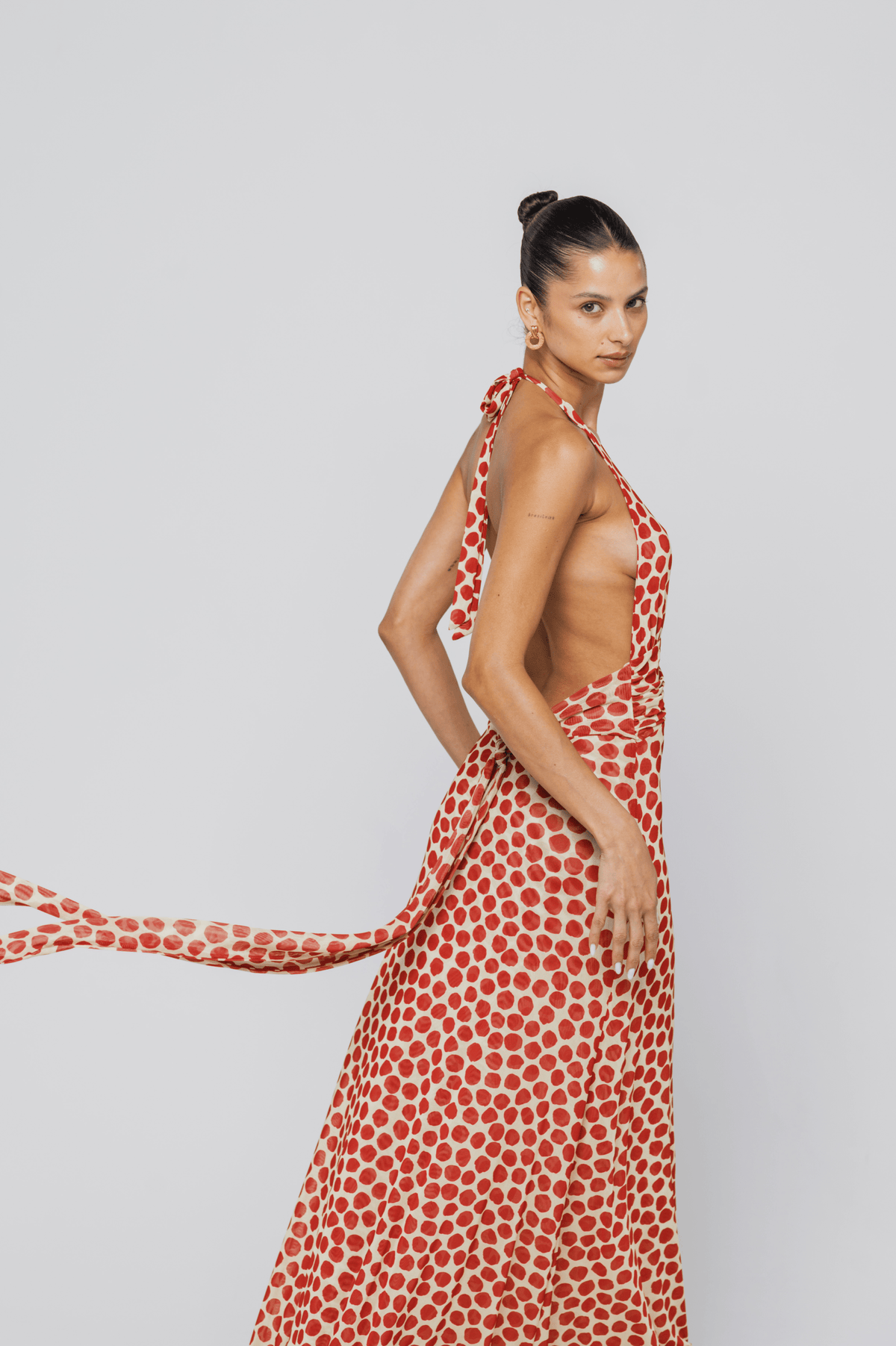 This is an image of Chelsea Dress in Campari - RESA featuring a model wearing the dress
