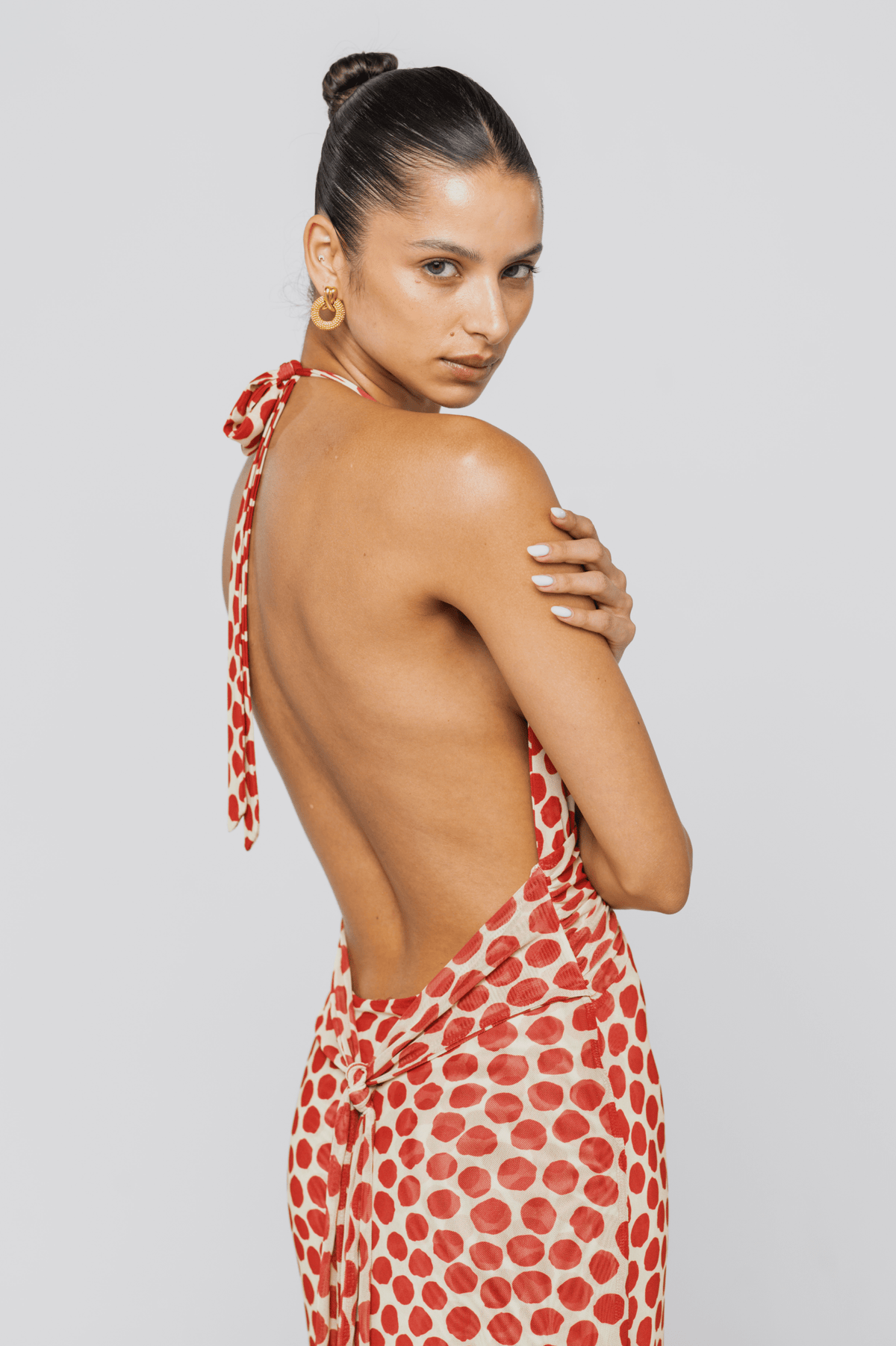 This is an image of Chelsea Dress in Campari - RESA featuring a model wearing the dress