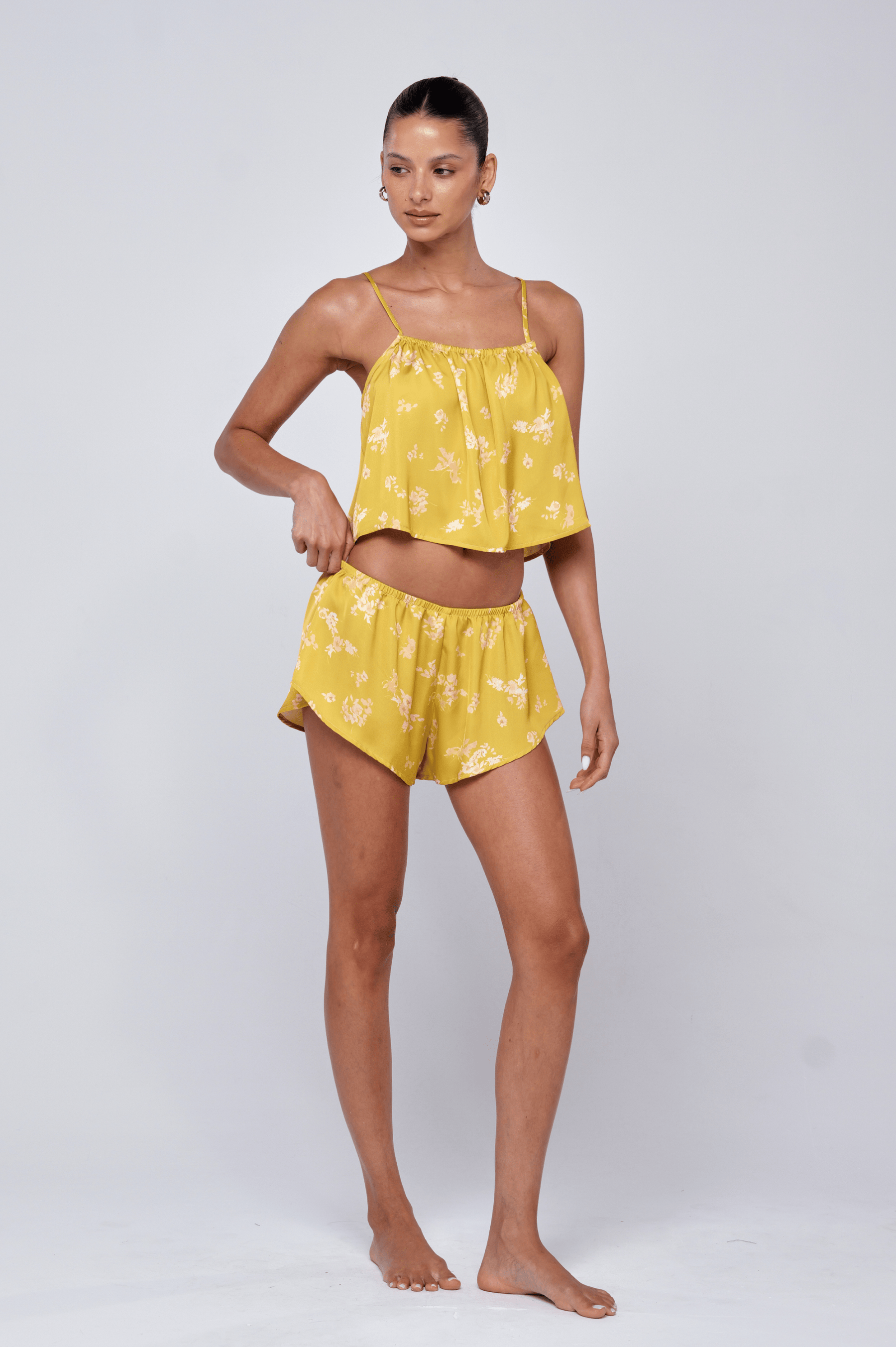 This is an image of Ellie Set in Citrus - RESA featuring a model wearing the dress