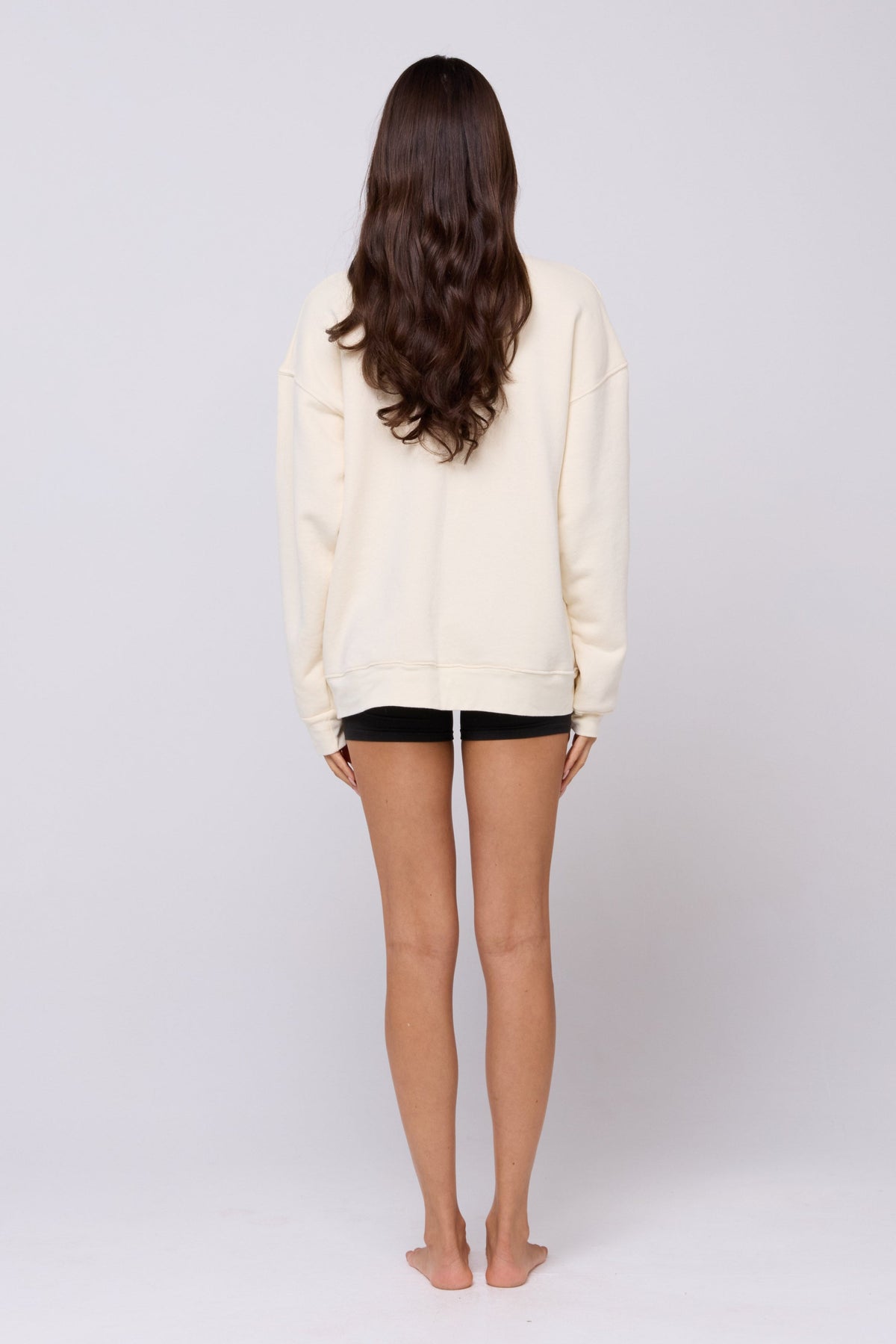 This is an image of Gunner Sweatshirt in Bone - RESA featuring a model wearing the dress