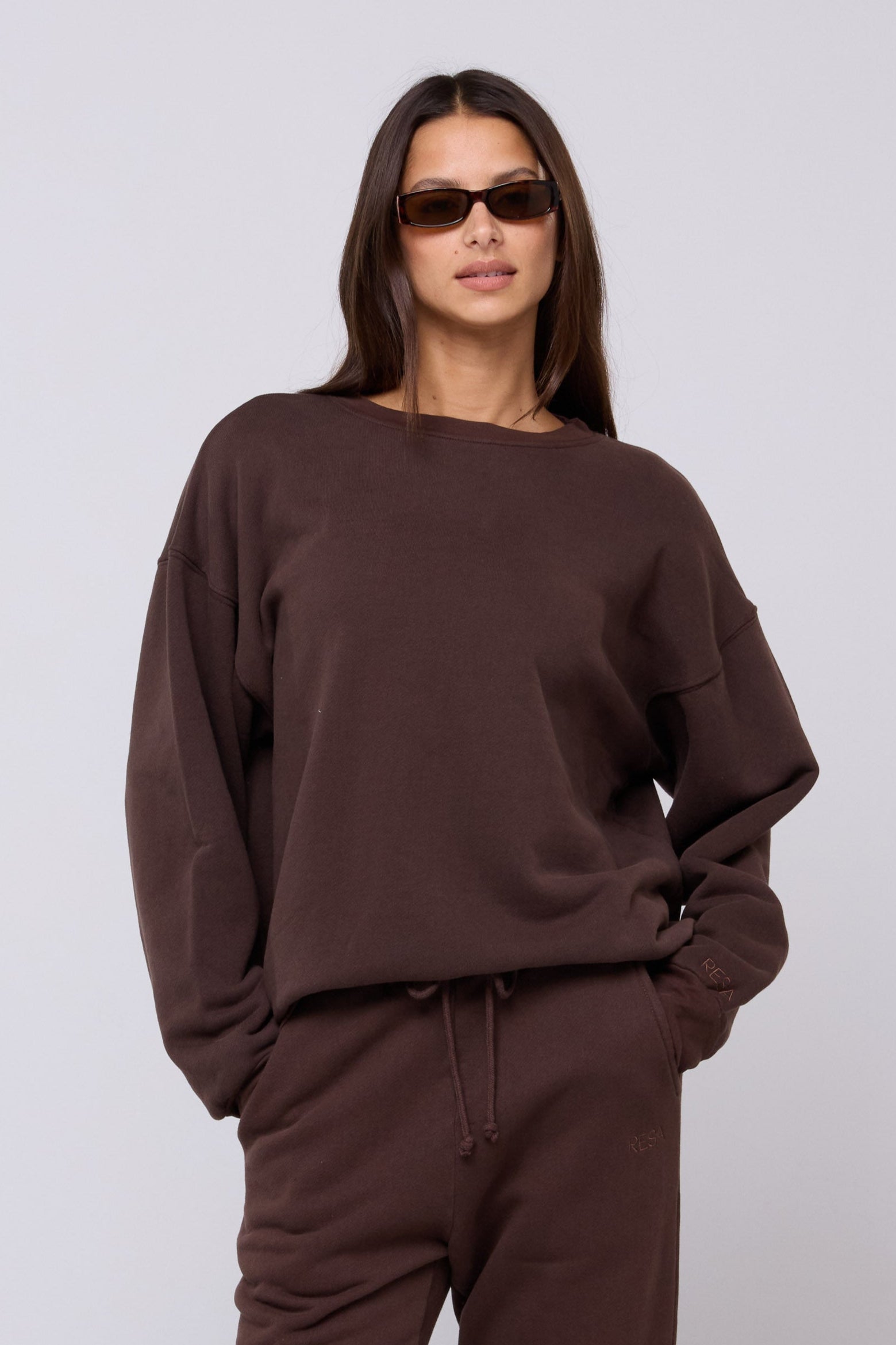 This is an image of Gunner Sweatshirt in Tobacco - RESA featuring a model wearing the dress