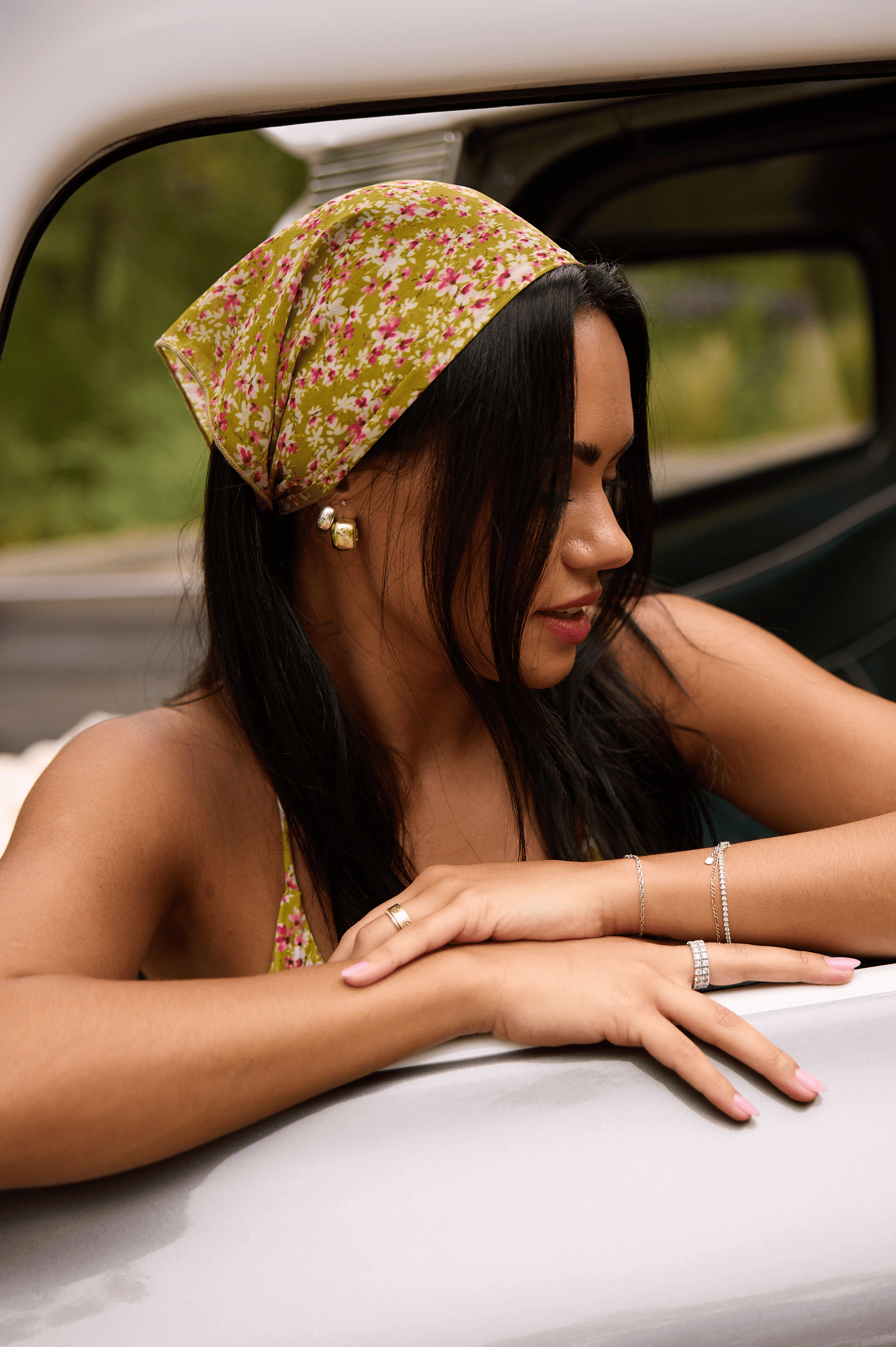 This is an image of Head scarf in Matcha - RESA featuring a model wearing the dress