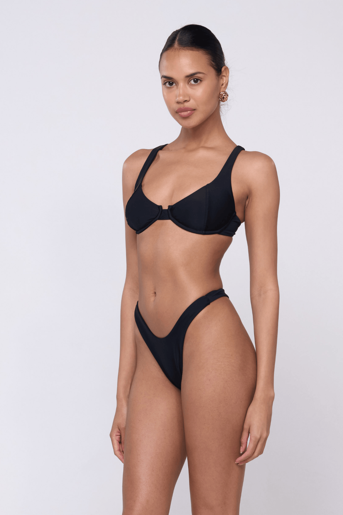 This is an image of Joey Bikini Bottom in Black - RESA featuring a model wearing the dress