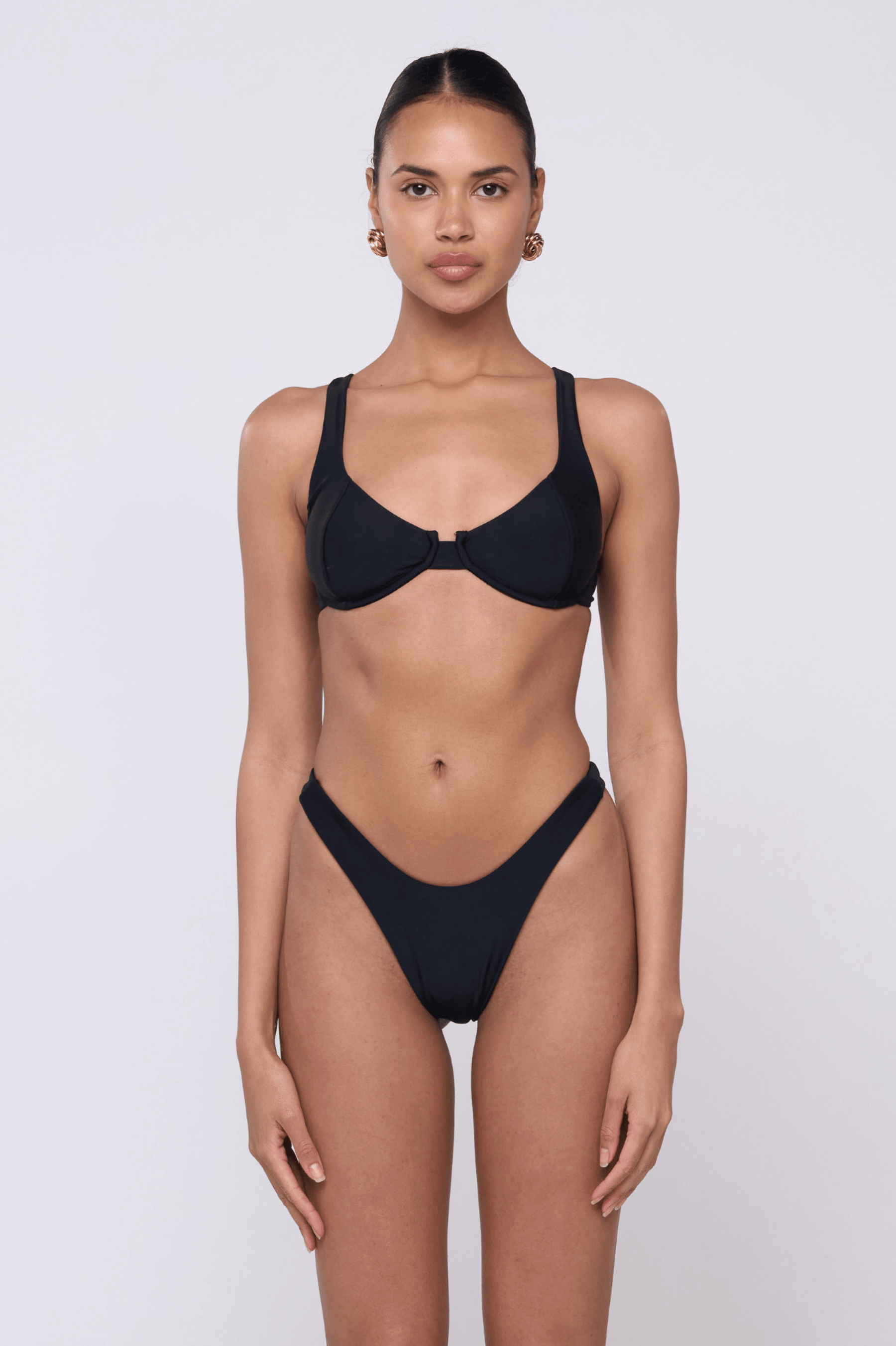 This is an image of Joey Bikini Bottom in Black - RESA featuring a model wearing the dress