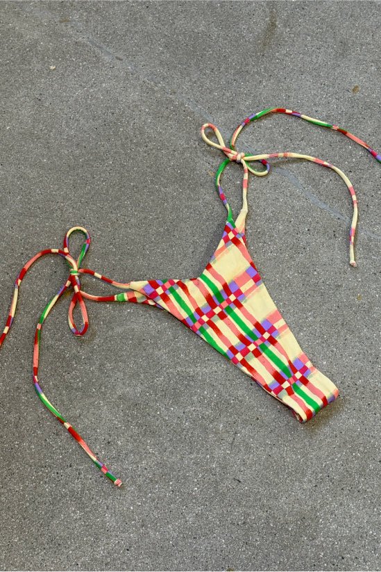 This is an image of Luke Bikini Bottom in Plaid - RESA featuring a model wearing the dress