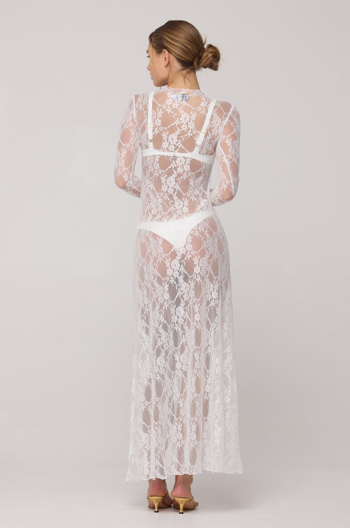 This is an image of Lyon Lace Dress in White Lace - RESA featuring a model wearing the dress
