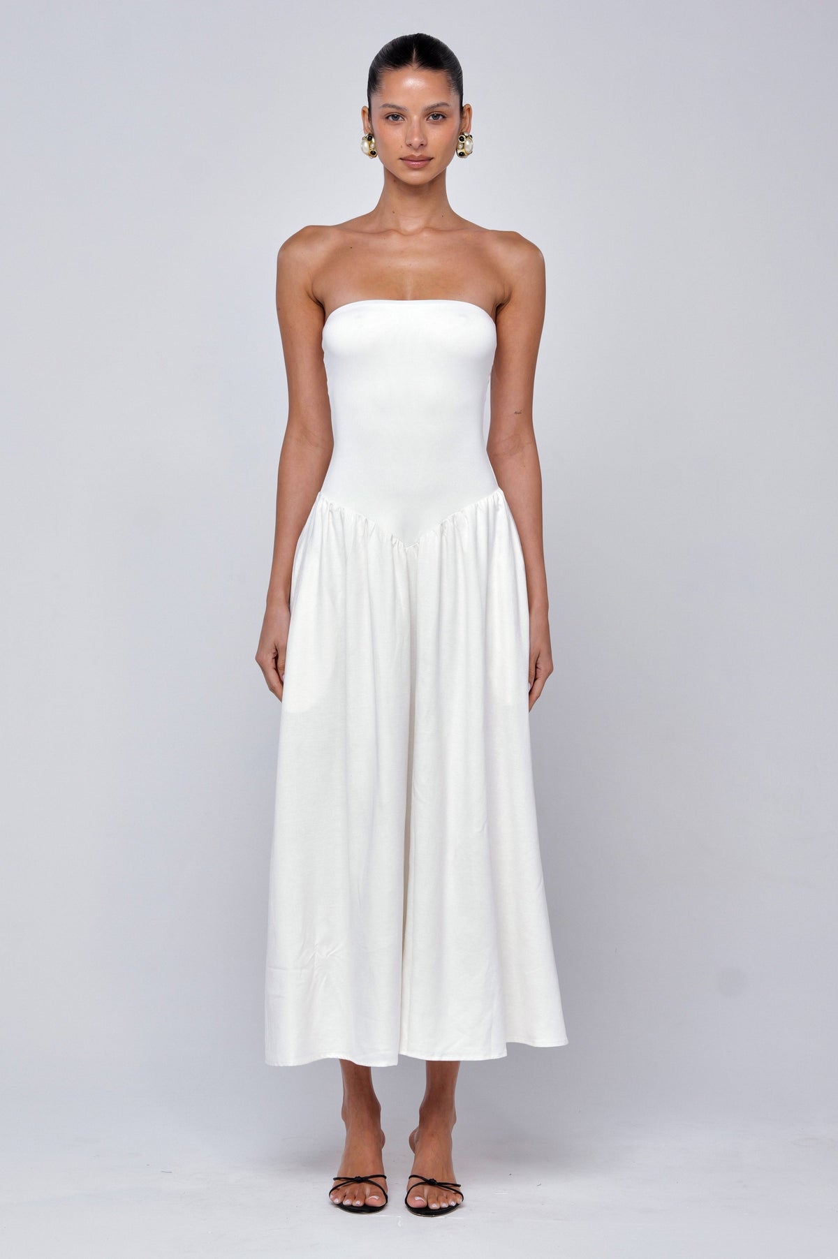 This is an image of Mackenzie Dress in White Linen - RESA featuring a model wearing the dress