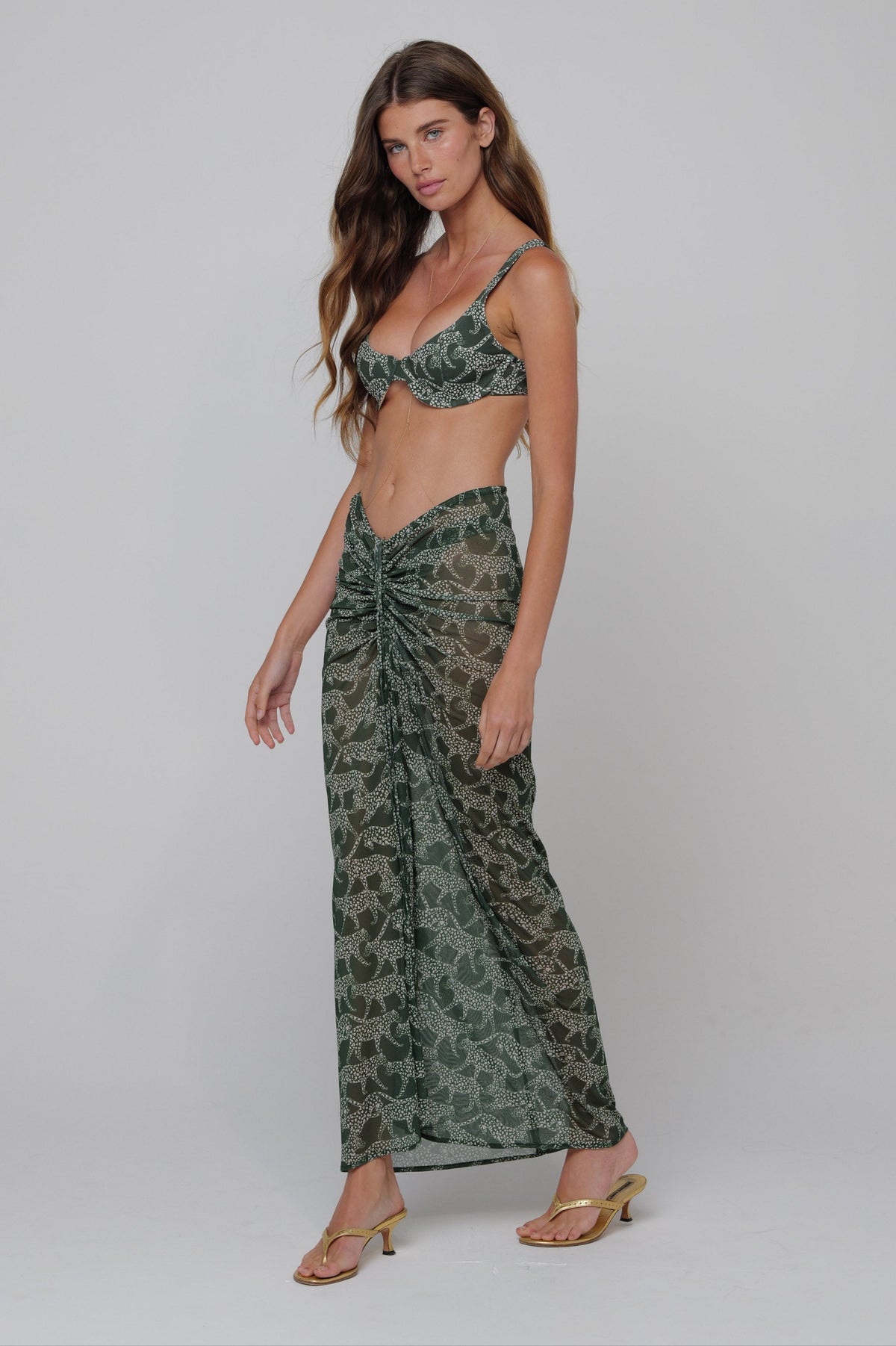 This is an image of Matty Bikini Top in Puma - RESA featuring a model wearing the dress