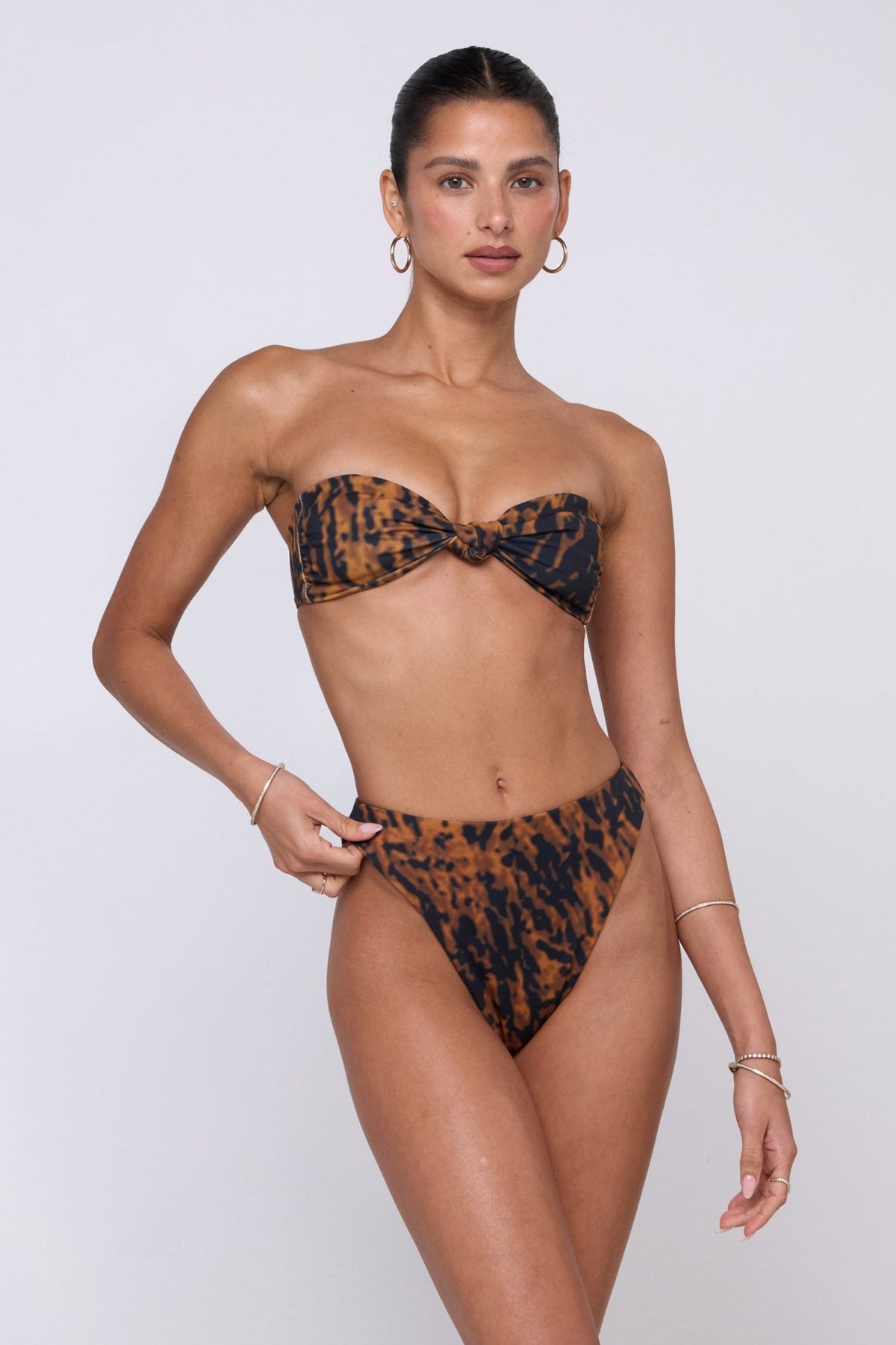 This is an image of Miles Bikini Bottom in Bond - RESA featuring a model wearing the dress