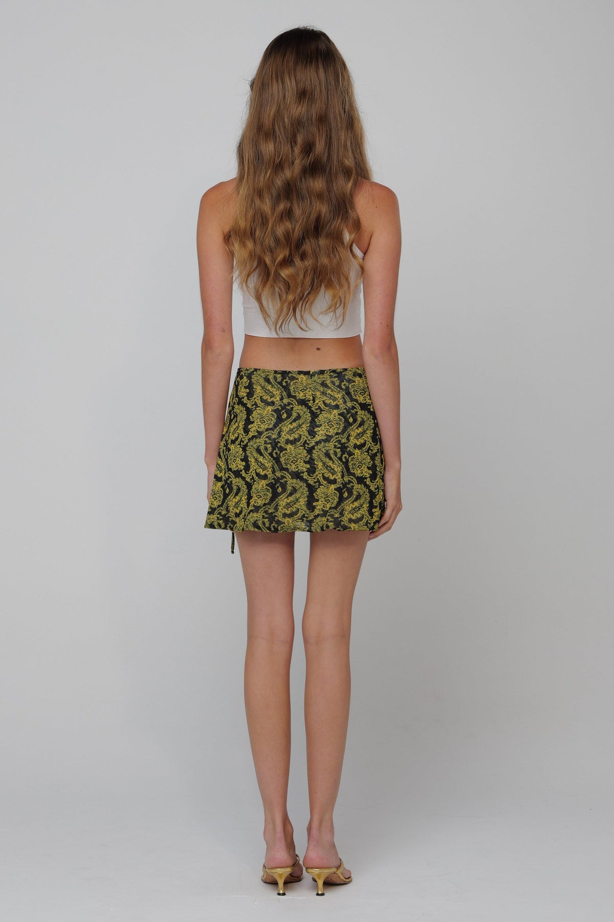 This is an image of Ollie Skirt in Sorrento - RESA featuring a model wearing the dress