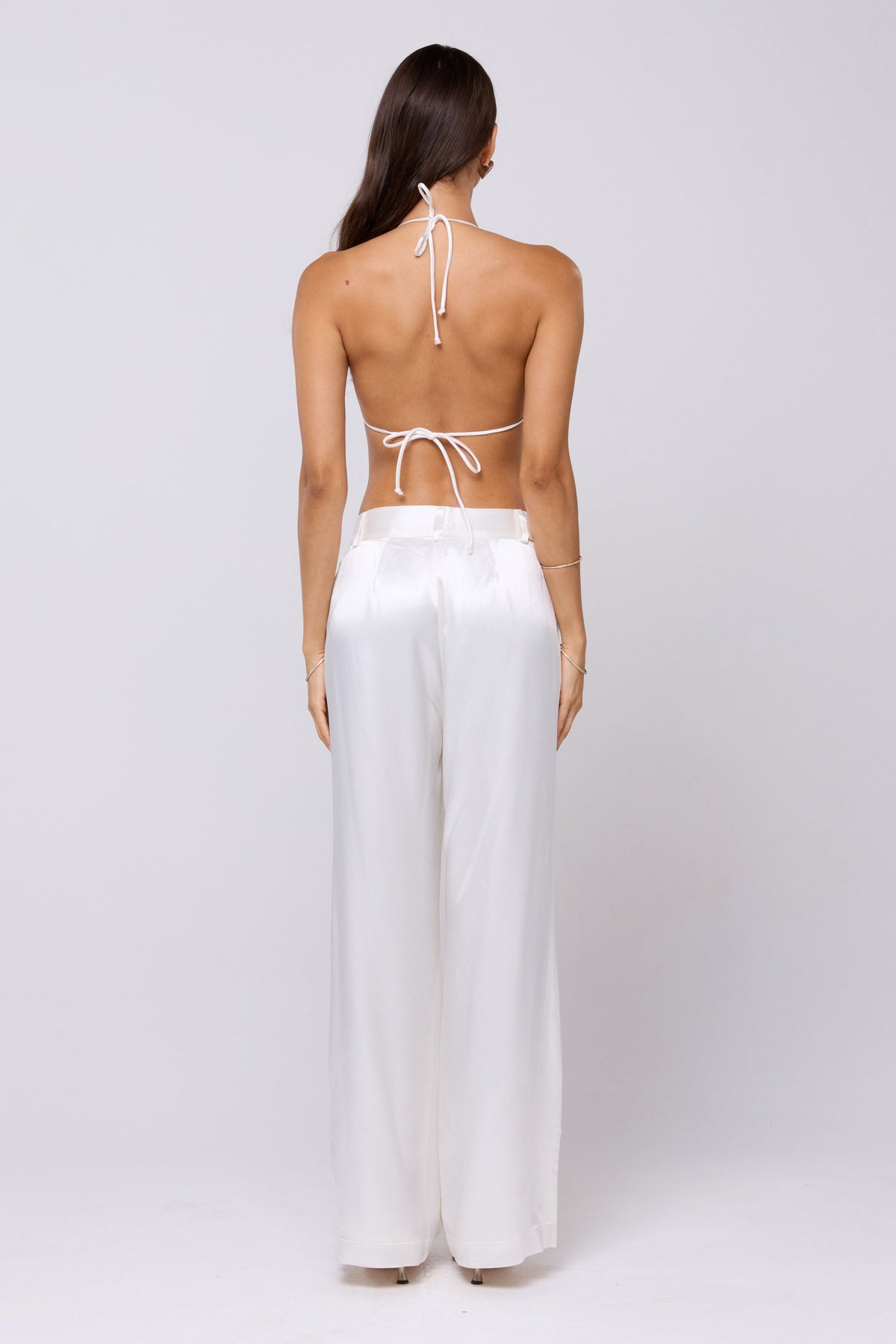 This is an image of Sasha Trouser in Pearl - RESA featuring a model wearing the dress