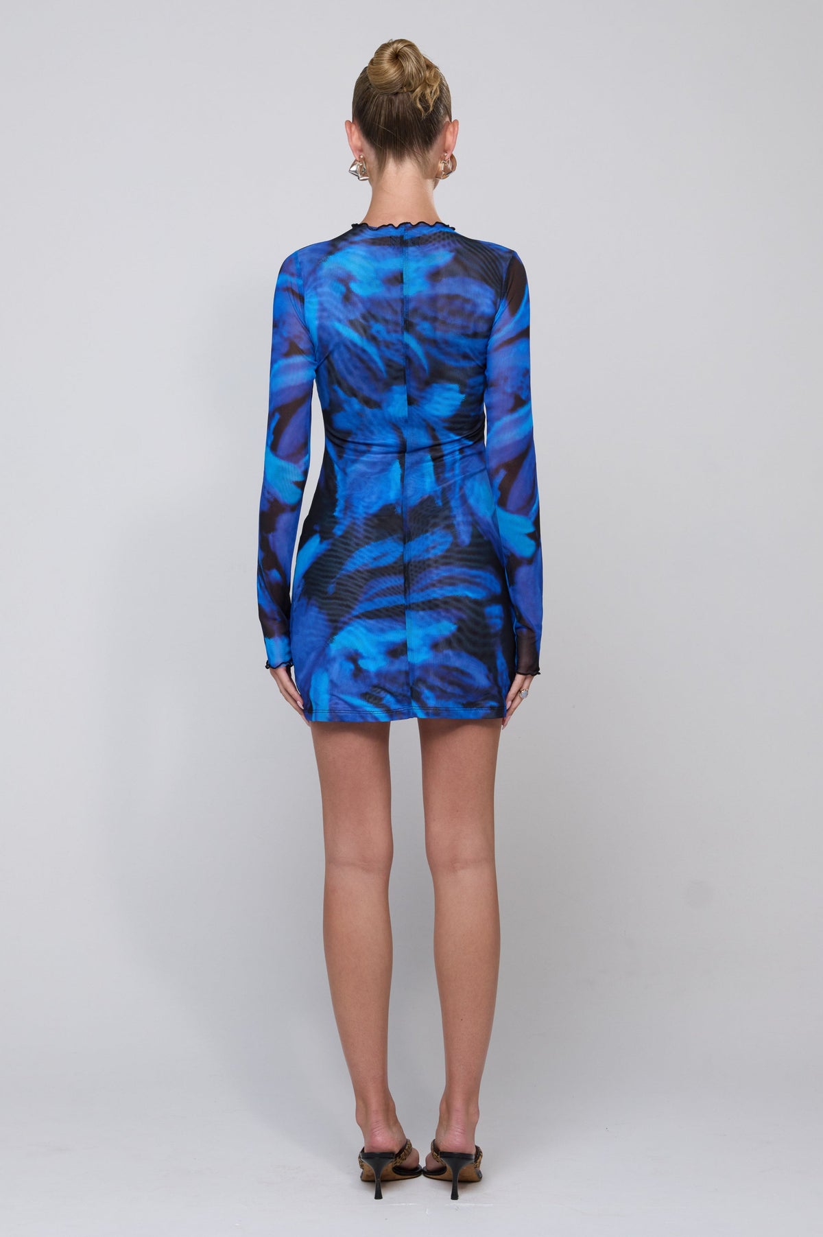 This is an image of Tyler Mini in Lagoon - RESA featuring a model wearing the dress