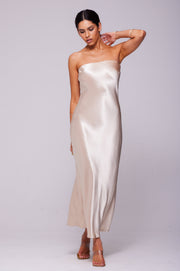 This is an image of Anna Slip in Champagne - RESA featuring a model wearing the dress