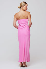 This is an image of Anna Slip in in Dragon Fruit - RESA featuring a model wearing the dress