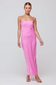 This is an image of Anna Slip in in Dragon Fruit - RESA featuring a model wearing the dress