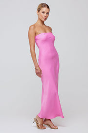 This is an image of Anna Slip in in Dragon Fruit - RESA featuring a model wearing the dress