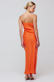 This is an image of Anna Slip in Papaya - RESA featuring a model wearing the dress