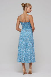 This is an image of Ashley Midi in Iris - RESA featuring a model wearing the dress