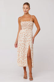 This is an image of Ashley Midi in Wildflower - RESA featuring a model wearing the dress