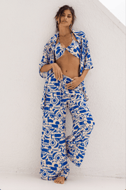 This is an image of Chase Pant in Pacific - RESA featuring a model wearing the dress