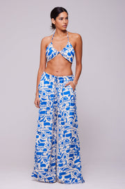 This is an image of Chase Pant in Pacific - RESA featuring a model wearing the dress