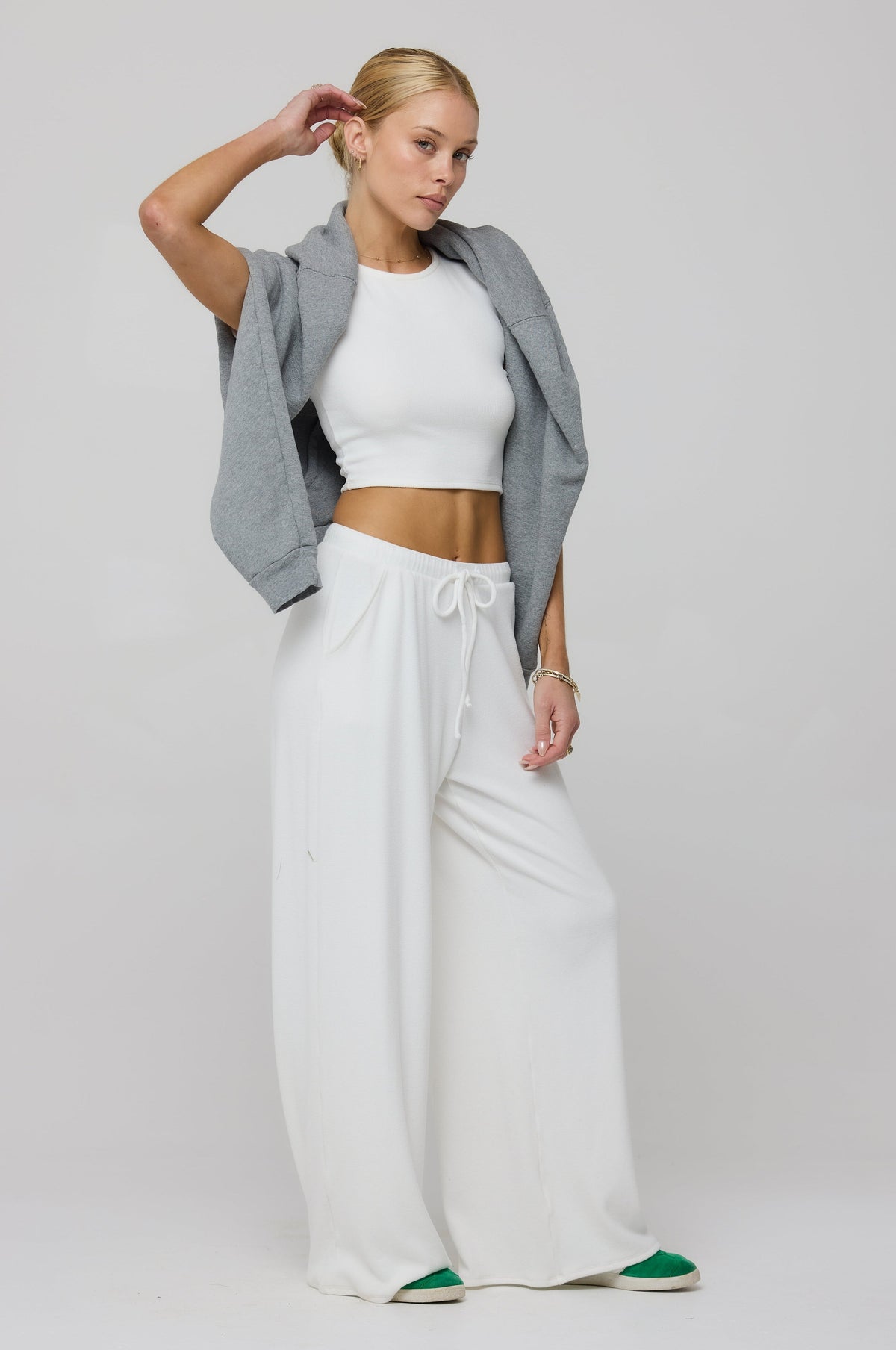 This is an image of Chase Rib Pant in White - RESA featuring a model wearing the dress