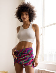 This is an image of Dash Skirt in Candy - RESA featuring a model wearing the dress