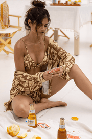 This is an image of Emma Top in Trestles - RESA featuring a model wearing the dress