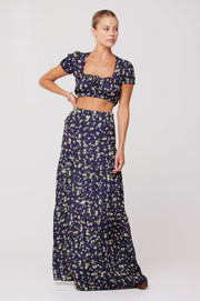 This is an image of Jamie Skirt in Midnight - RESA featuring a model wearing the dress