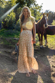 This is an image of Jamie Skirt in Wildflower - RESA featuring a model wearing the dress