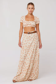 This is an image of Jamie Skirt in Wildflower - RESA featuring a model wearing the dress