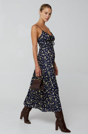 This is an image of Kaitlyn Midi in Midnight - RESA featuring a model wearing the dress