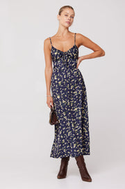 This is an image of Kaitlyn Midi in Midnight - RESA featuring a model wearing the dress