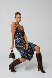 This is an image of Kaitlyn Midi in Midnight - RESA featuring a model wearing the dress