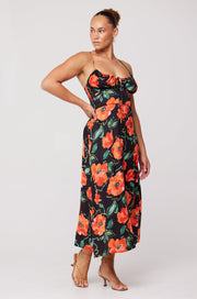 This is an image of Kaitlyn Midi in Poppy - RESA featuring a model wearing the dress