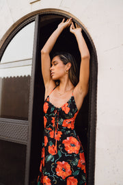 This is an image of Kaitlyn Midi in Poppy - RESA featuring a model wearing the dress
