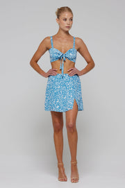 This is an image of Katie Crop in Iris - RESA featuring a model wearing the dress