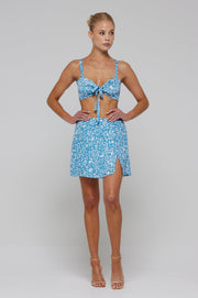 This is an image of Kenzie Skirt in Iris - RESA featuring a model wearing the dress