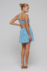 This is an image of Kenzie Skirt in Iris - RESA featuring a model wearing the dress