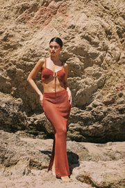 This is an image of Leina Top in Brick - RESA featuring a model wearing the dress