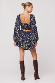 This is an image of Lyla Mini in Midnight - RESA featuring a model wearing the dress