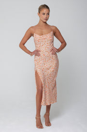 This is an image of Madison Slip in Sunstone - RESA featuring a model wearing the dress