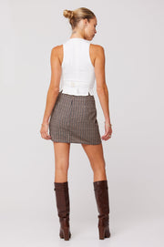 This is an image of Mazzy Mini Skirt in Contempo - RESA featuring a model wearing the dress
