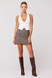 This is an image of Mazzy Mini Skirt in Contempo - RESA featuring a model wearing the dress