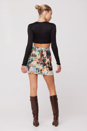 This is an image of Mazzy Mini Skirt in Shakespeare - RESA featuring a model wearing the dress