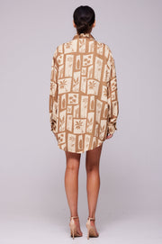 This is an image of Monica Blouse in Trestles - RESA featuring a model wearing the dress