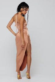 This is an image of Nicole Midi in Copper - RESA featuring a model wearing the dress