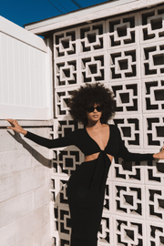 This is an image of Noelle Maxi - RESA featuring a model wearing the dress
